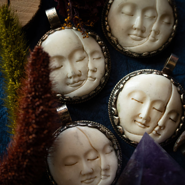 Hand-Carved Moon Faces Pendant